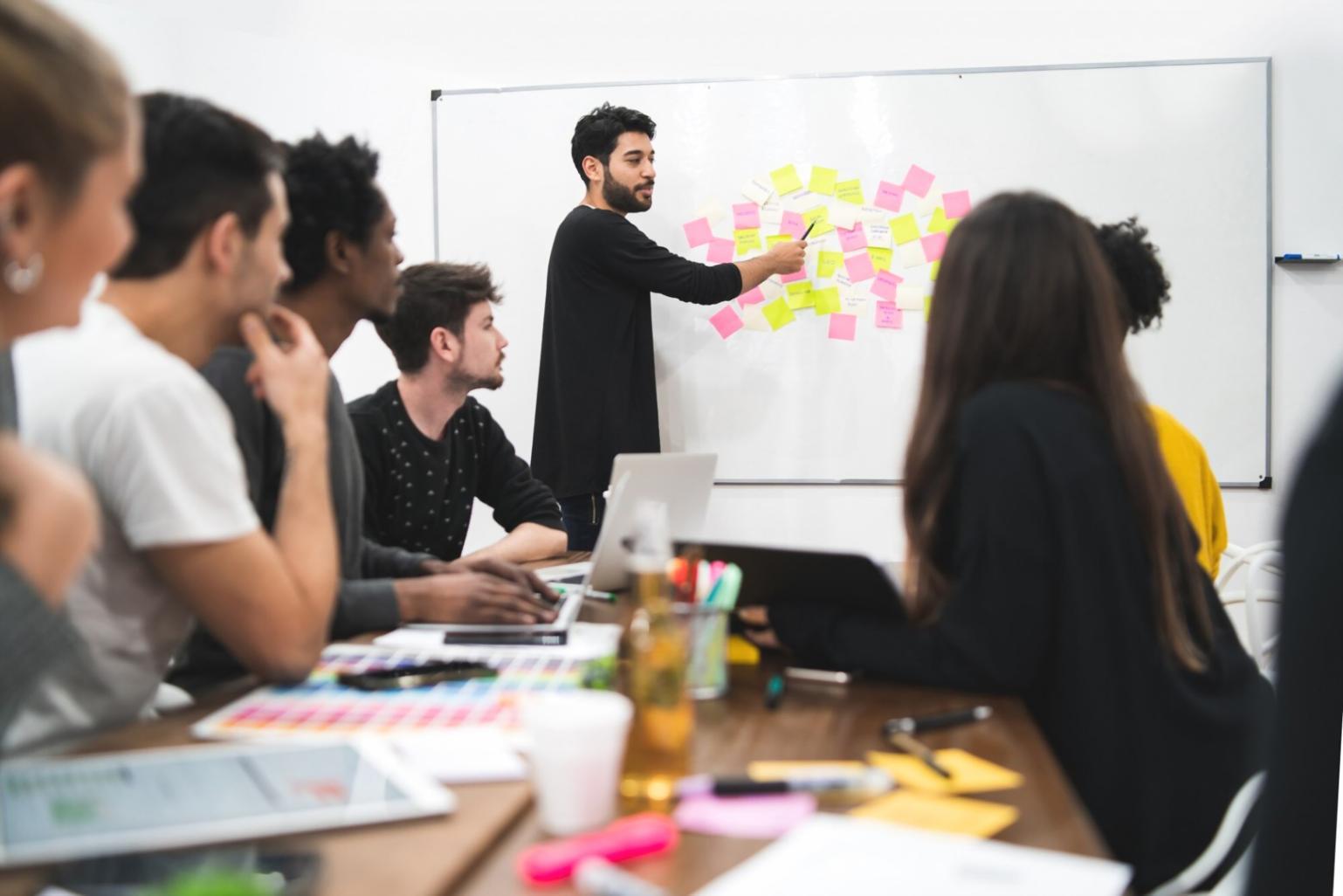 Executive discussing financial strategies in modern boardroom setting